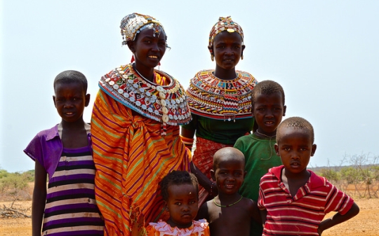 a masaai family posing for photo