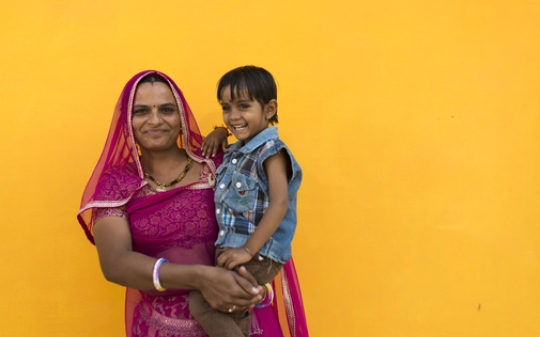 A lady and her son smiling A lady and her son smiling