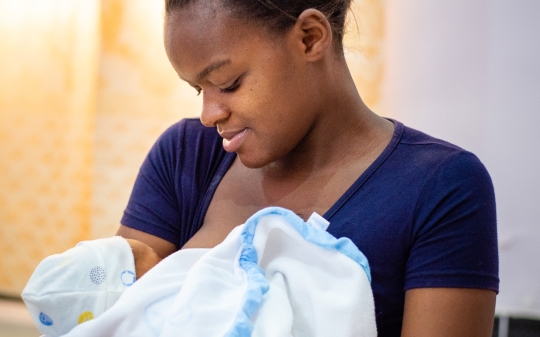 a-mother-breastfeeding-her-baby a-mother-breastfeeding-her-baby