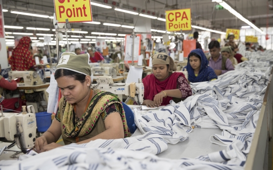 Ladies sewing clothes in a garment factory