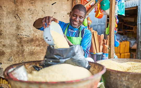 a man pouring grain