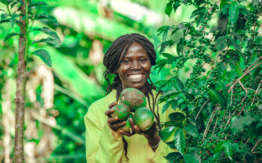 Woman holding avocados 