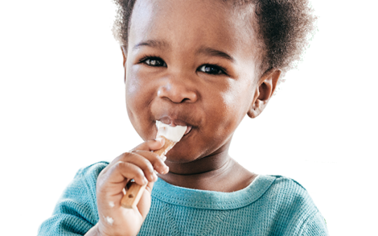 a child eating yoghurt a child eating yoghurt